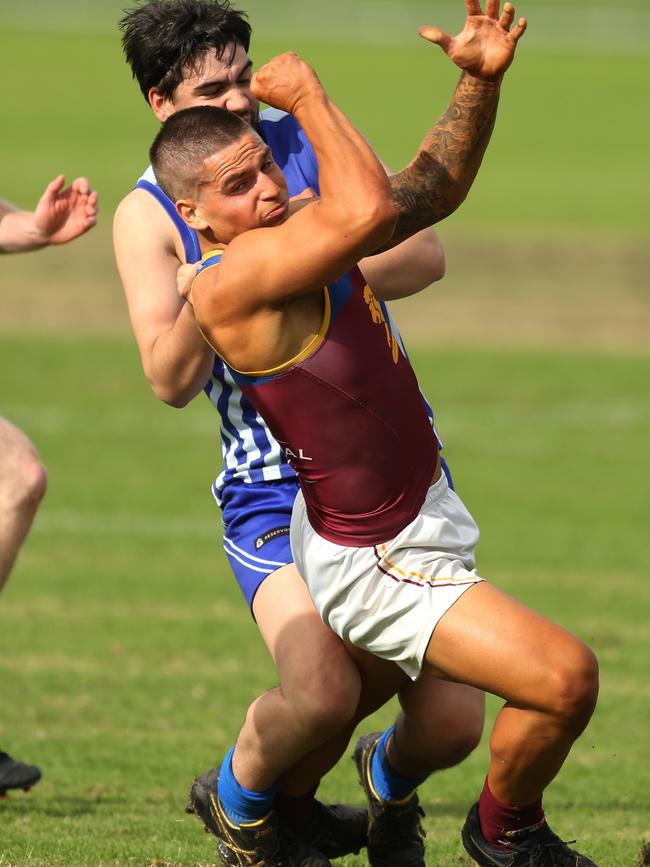 NFL: South Morang’s Noah Dalmau gets a handball away under pressure. Picture: Stuart Milligan