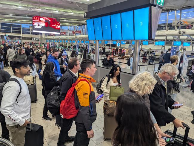 Sydney Airport was in dissaray on Friday night after the global IT outage that has cost the state more than $200 million. Picture: Justin Lloyd