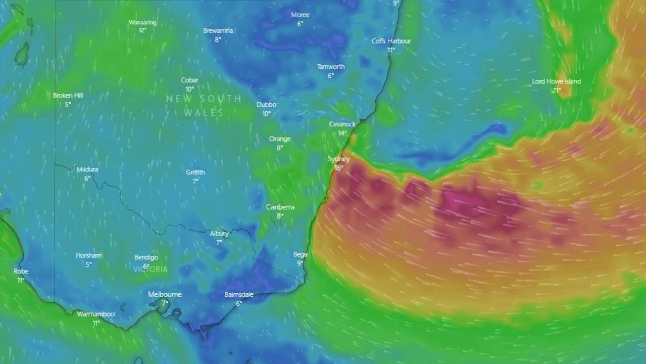 The East Coast Low (coloured pink and orange) made landfall on Sunday and will continue to batter Sydney on Monday. Picture: Windy.