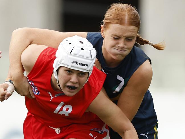 MELBOURNE, AUSTRALIA - APRIL 06:  Sophie McKay of the AFL National Academy Girls tackles Seisia White of the U23 All-Stars during the Marsh AFL National Academy Girls vs U23 All-Stars at Ikon Park on April 06, 2024 in Melbourne, Australia. (Photo by Darrian Traynor/AFL Photos/via Getty Images)