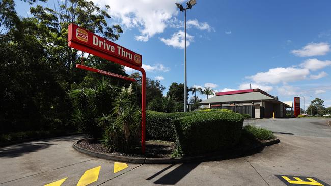 A 44-year-old woman is dead after her car was swept away in floodwaters from Hungry Jack's in Aspley last night. Pics Tara Croser.