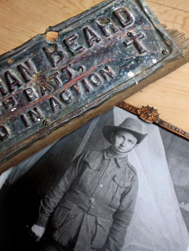 A faded photograph and the rediscovered memorial plaque of Private Norman Eric Beard, of Jericho.