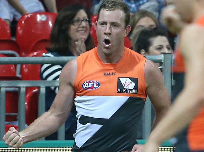 Steve Johnson of the Giants (left) celebrates after scoring a goal during the round 9 AFL match between the Greater Western Sydney Giants and the Western Bulldogs at Spotless Stadium in Sydney, Sunday, May 22, 2016. (AAP Image/David Moir) NO ARCHIVING, EDITORIAL USE ONLY