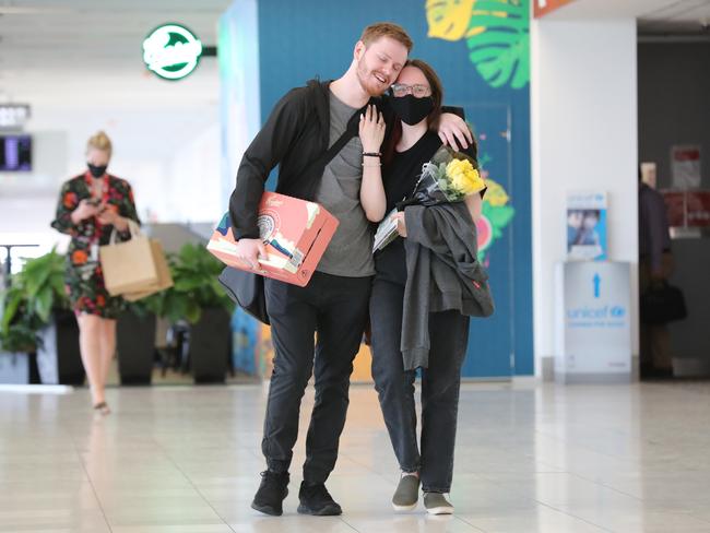 After nine months of not seeing each other, Ash McCall hugged his girlfriend Harriet Beard now the SA borders are open to Victoria. Picture: Tait Schmaal.