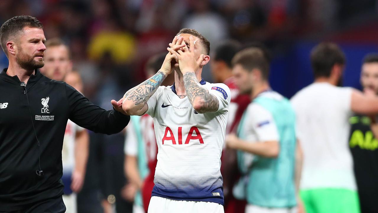 Kieran Trippier of Tottenham Hotspur hides his face as he stands dejected following the UEFA Champions League Final