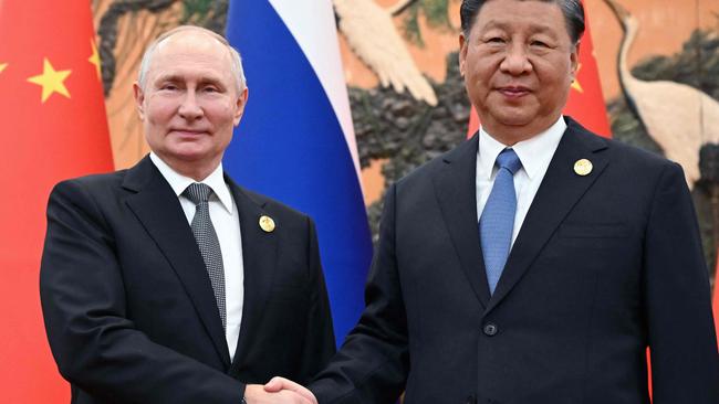 President Vladimir Putin and Chinese President Xi Jinping shaking hands during a meeting in Beijing, October 2023. Picture: Sergei Guneyev/AFP