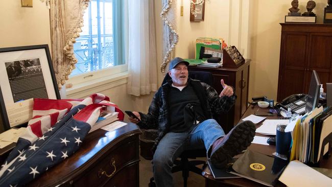 Trump supporter Richard Barnett sits inside the office of US Speaker of the House Nancy Pelosi . Picture: Saul Loeb / AFP