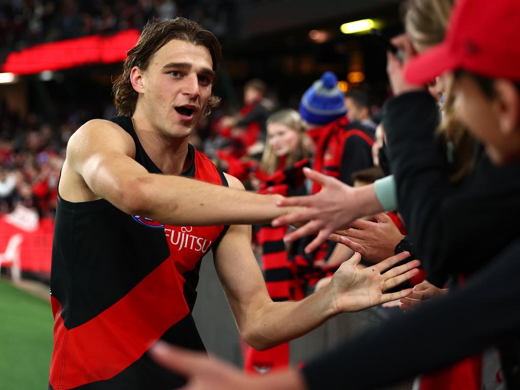 Harrison Jones high fives fans after the win against West Coast. Jones says Marvel Stadium has become a ‘fortress’ for Essendon. Picture: Quinn Rooney/Getty Images.