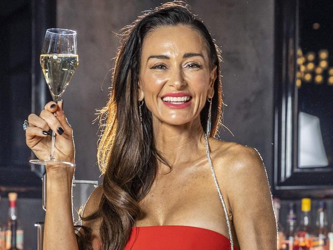 Kyla Kirkpatrick drinks champagne at Bar Americano. Picture: Jake Nowakowski