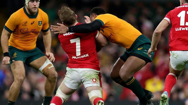 CARDIFF, WALES - NOVEMBER 17: Jac Morgan of Wales is tackled by Samu Kerevi of Australia, which is later concluded as a high tackle following a TMO Review resulting in a yellow card before being escalated to a 20 Minute Red Card following the conclusion of the Bunker Review, duringthe Autumn Nations Series 2024 match between Wales and Australia at the Principality Stadium on November 17, 2024 in Cardiff, Wales. (Photo by David Rogers/Getty Images)