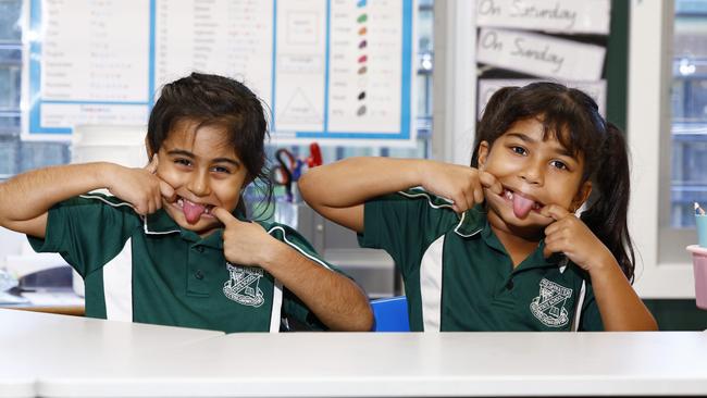 MY FIRST YEAR 2024 – Freshwater State School prep students Amber Bhanbra, 5, and Angel Subin, 5, pull silly faces in the classroom while poses for their prep photos. Picture: Brendan Radke