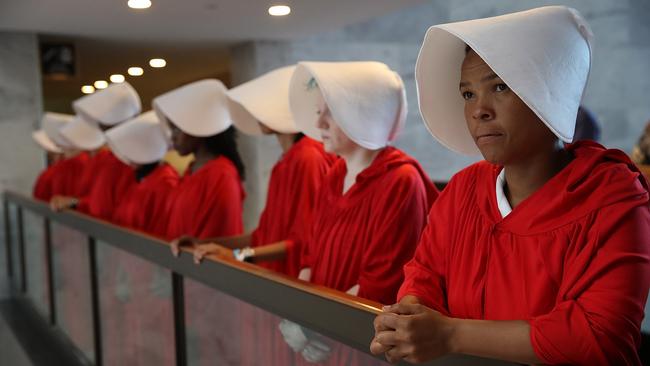 Protesters dressed in The Handmaid's Tale costume protest outside the hearing room where Supreme Court nominee Judge Brett Kavanaugh is testifying on Capitol Hill.