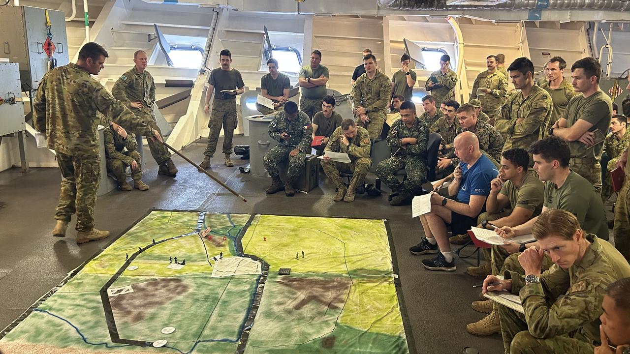 Plotting Exercise Alon air, land and sea drills from the HMAS Canberra, off the Philippines coast in the South China Sea and Sulu Sea. Picture: Charles Miranda