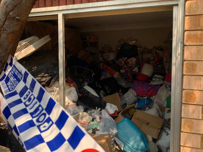 Emergency services were forced to rescue the woman after she fell and became trapped under a mountain of filth. Picture: Nick Hansen