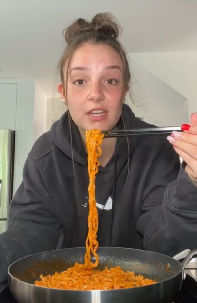 A TikTok trend emerged recently where people film themselves eating the ‘crazy hot’ ramen on camera. Picture: TikTok/@ellasavoiee