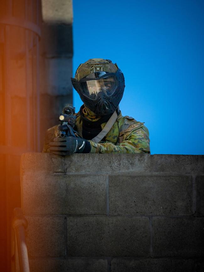 An Australian army soldier from the 3rd Battalion, Royal Australian Regiment, provides security during the conduct of an urban assault serial using the Blue Bolt non-lethal training ammunition as part of the 2022 Duke of Gloucester Cup in Singleton. *** Local Caption *** Australian Army infantry soldiers from across Australia tested their core skills for the prestigious Duke of Gloucester Cup at the School of Infantry, near Singleton in NSW, July 31 - August 5 2022. The Duke of Gloucester Cup is the Armyâ€™s premier military skills competition, pitting the best Royal Australian Corps of Infantry rifle sections from each unit against one another through a series of challenging activities that test their core infantry skills, including marksmanship, tactics, teamwork and fitness. Along with the Duke of Gloucester Cup, five other trophies are awarded: Sir Arthur MacDonald Trophy for best foundation war-fighting skills; Gurkha Trophy for best live-fire shooting; Royal Ulster Rifles Trophy for best falling plate shooting; OSCMAR Trophy for best battle endurance; and the DSM Roche CSC Memorial Cup for best individual soldier. The Duke of Gloucester Cup was created by Prince Henry, Duke of Gloucester, in 1946, while serving as the Governor-General of Australia.