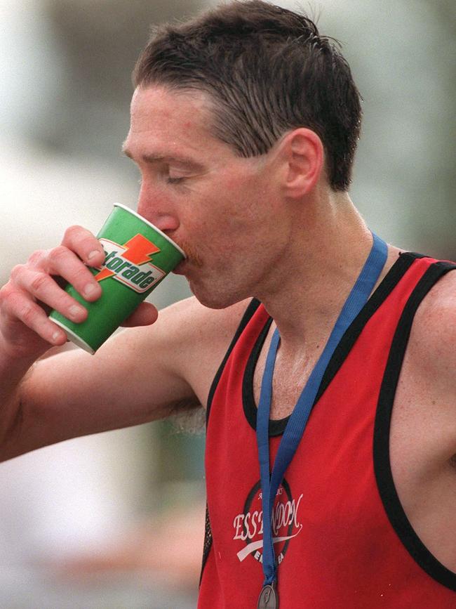 Michael McIntyre enjoys a drink after winning the 1999 Melbourne Marathon.