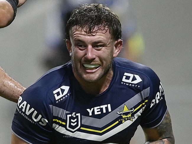 TOWNSVILLE, AUSTRALIA - MAY 04: Sam McIntyre of the Cowboys celebrates after scoring a try  during the round nine NRL match between North Queensland Cowboys and Dolphins at Qld Country Bank Stadium, on May 04, 2024, in Townsville, Australia. (Photo by Ian Hitchcock/Getty Images)