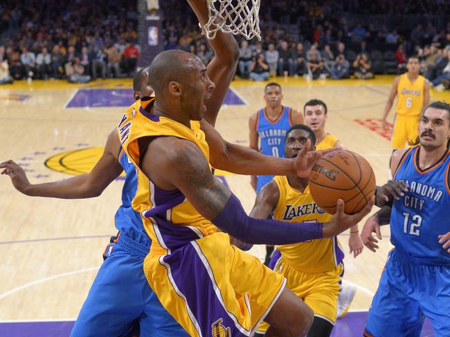 Kobe Bryant prepares to shoot as Oklahoma City Thunder centre Steven Adams, right, defends.