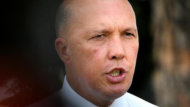 Minister for Home Affairs Peter Dutton speaks to the media during a doorstop in Kallangur, Queensland, Thursday, February 7, 2019. (AAP Image/Albert Perez) NO ARCHIVING