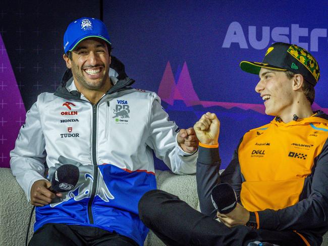 Daniel Ricciardo and Oscar Piastri chat during a driver press conference. Picture: Jake Nowakowski