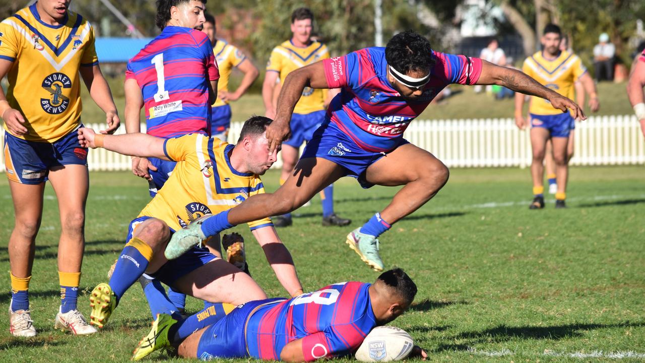 Ezekiel Phillips tries to avoid stepping on Kareel Phillips. Picture: Sean Teuma. Souths Juniors A-grade preliminary final Alexandria Rovers vs Coogee Dolphins at Mascot Oval, 1 September 2024.