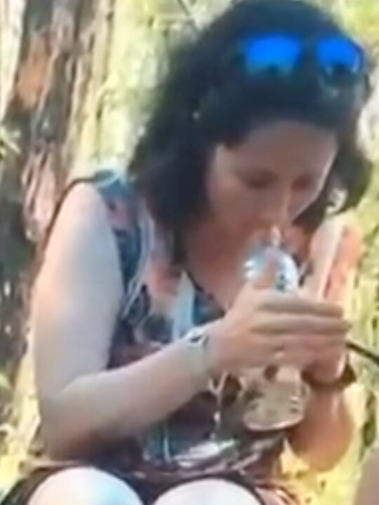 Screen grabs from footage that surfaced of Lucas Heights teacher Lauren Russell with students in school uniform. She appears to be smoking a bong.