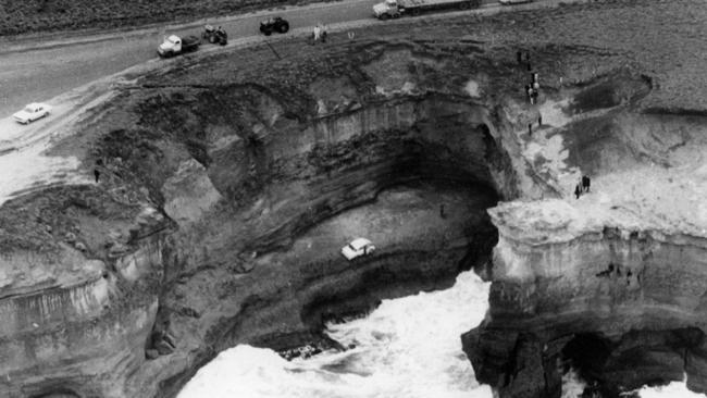 The family car containing the bodies of Crawford's wife and children at the bottom of the cliff at Port Campbell.