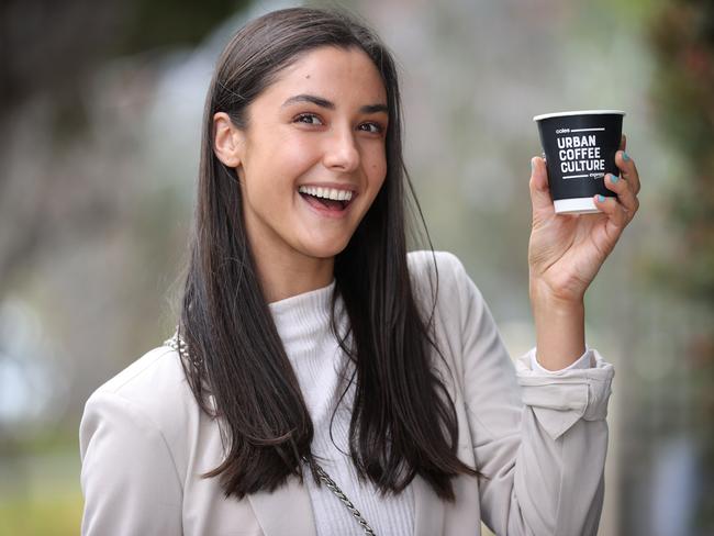 We find the best coffee for on the go. Caitlin De Klijn with a cup of coffee outside Coles Express, Ashburton.                     Picture: David Caird