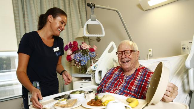 Nurse Courtney Bell chats with patient Leo Schofield, who was recovering from a double knee replacement surgery in St Vincent's Private Hospital. Picture: John Appleyard