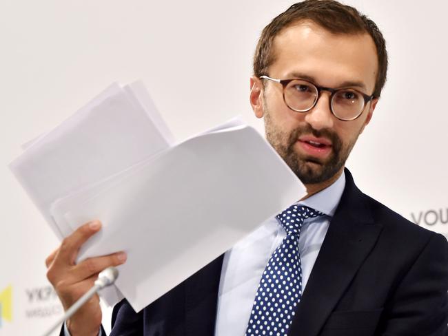 Ukrainian journalist and member of parliament Serhiy Leshchenko holds pages showing allegedly signings of payments to Donald Trump's presidential campaign chairman Paul Manafort from an illegal shadow accounting book of the party of former Ukrainian president Viktor Yanukovych.  Picture:  AFP