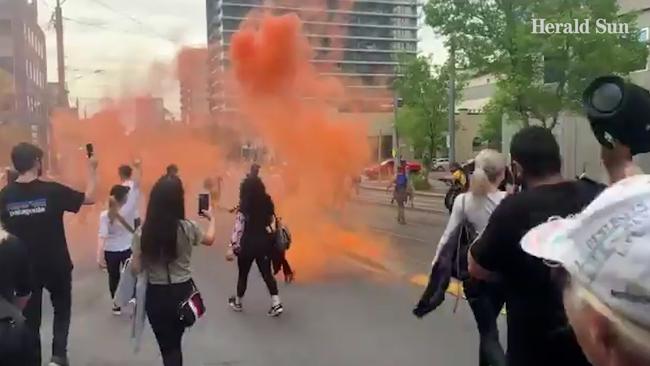 Protesters set off flares during a demonstration against lockdowns. Picture: Brianna Travers