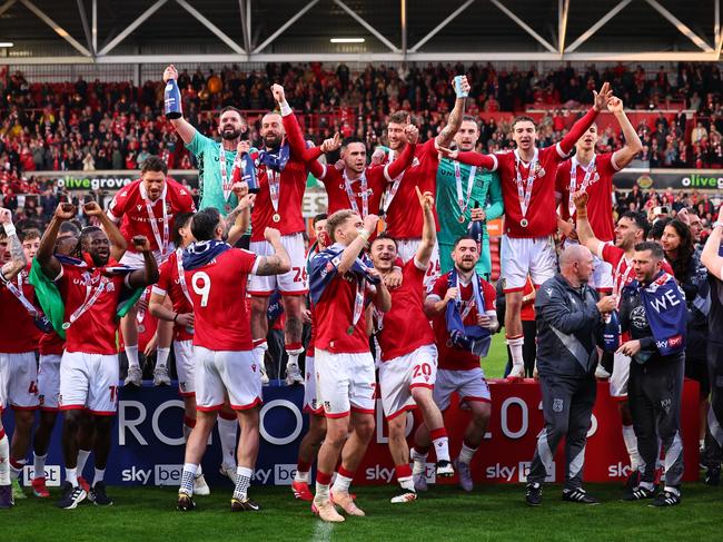 WREXHAM, WALES - APRIL 26: James McClean of Wrexham celebrates winning promotion to the championship with team mates during the Sky Bet League One match between Wrexham AFC and Charlton Athletic FC at Racecourse Ground on April 26, 2025 in Wrexham, Wales. (Photo by Robbie Jay Barratt - AMA/Getty Images)