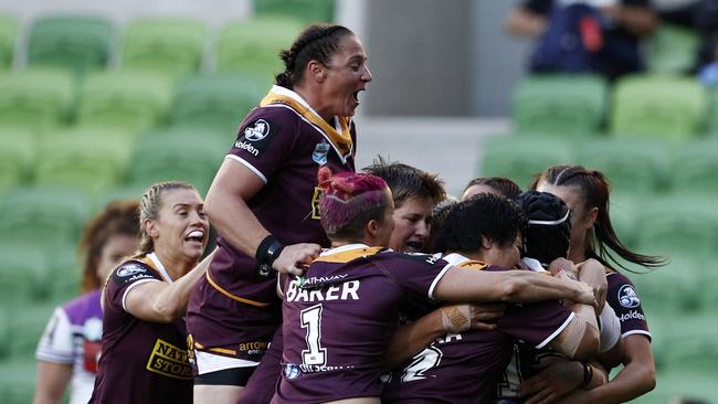 Broncos players celebrate a Julia Robinson try against the Warriors at AAMI Park. Picture: AAP