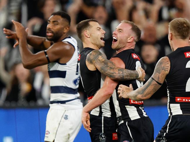 MELBOURNE, AUSTRALIA - MARCH 17: Jamie Elliott (left) and Tom Mitchell of the Magpies celebrate during the 2023 AFL Round 01 match between the Geelong Cats and the Collingwood Magpies at the Melbourne Cricket Ground on March 17, 2023 in Melbourne, Australia. (Photo by Michael Willson/AFL Photos via Getty Images)