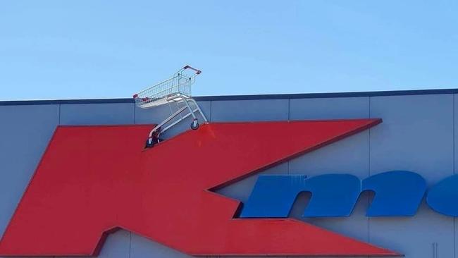 A trolley on top of a Kmart sign. Photo: Isaac Sayal