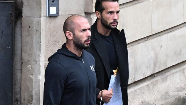 Tate and his brother, Tristan, exit court in Bucharest, Romania. Picture: Daniel Mihailescu/AFP