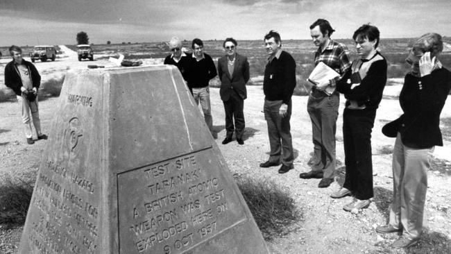 A group of journalists, bureaucrats and dignitaries inspect the Taranaki test site at Maralinga in 1984. Picture: Tony Lewis