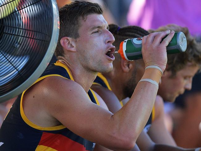 Josh Jenkins of the Crows cools off during the JLT Community Series.