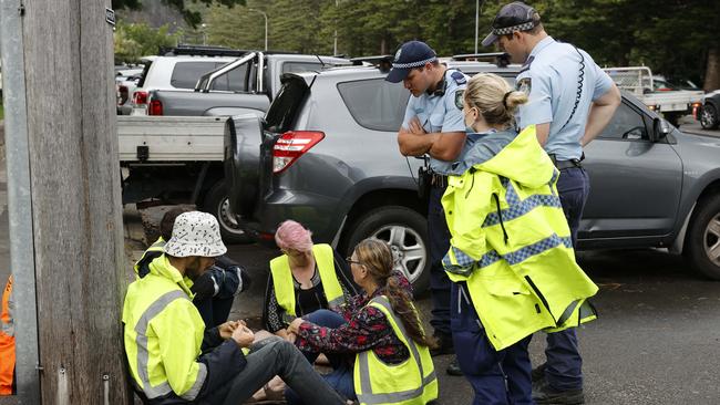 A number of the Fireproof Australia activists were detained by police over the unauthorised protest. Picture: Tim Hunter