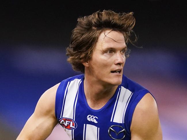 Jared Polec of the Kangaroos runs with the ball during the Round 3 AFL match between the North Melbourne Kangaroos and the Sydney Swans at Marvel Stadium in Melbourne, Saturday, June 20, 2020. (AAP Image/Michael Dodge) NO ARCHIVING, EDITORIAL USE ONLY