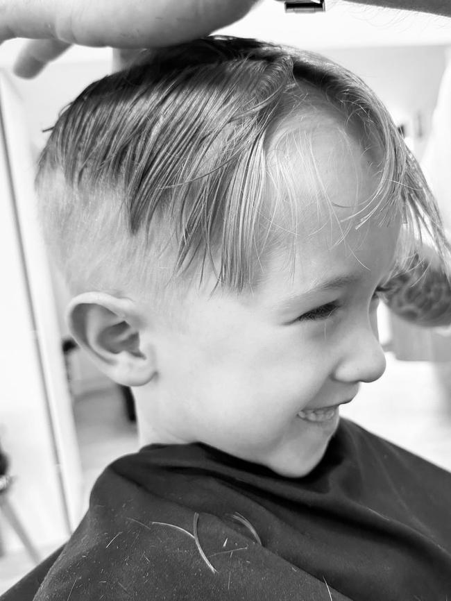 Alfie at the barber with his mum. Picture: Supplied