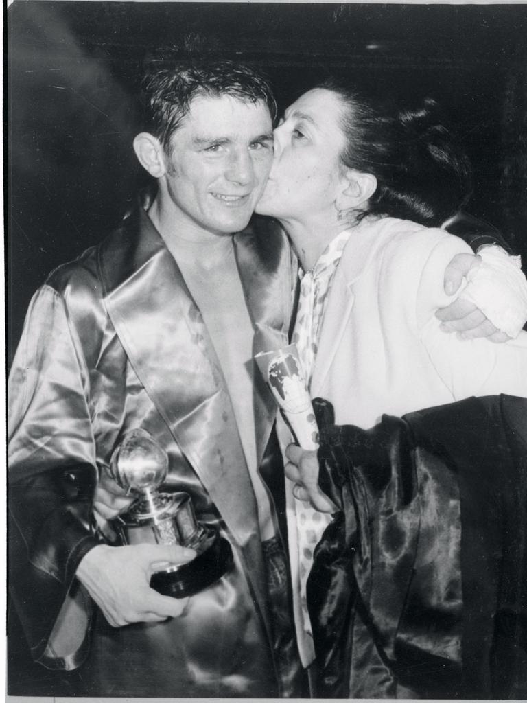 Johnny Famechon receives a congratulatory kiss form his mother after winning the World Featherweight Championship at Royal Albert Hall.