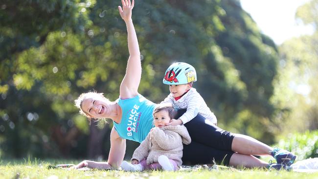 Felicity Sutherland exercises with Maxwell, 3, and Nina, 1. Picture: Bob Barker