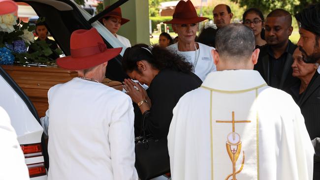 Anoma Wijeweera breaks down as her son’s coffin leaves the church for burial. Picture: Justin Lloyd