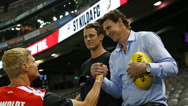 Koschitzke and former teammates Matt Maguire wish Riewoldt good luck before a Saints game in 2016. Pic: George Salpigtidis