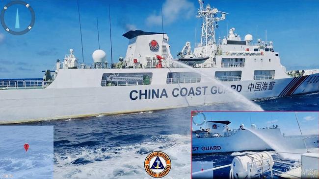 This handout released by the Philippine Coast Guard (PCG) on August 6, 2023 shows a China Coast Guard ship releasing water cannon on a Philippine Coast Guard ship near Second Thomas Shoal during a re-supply mission on August 5. Picture: PCG/AFP