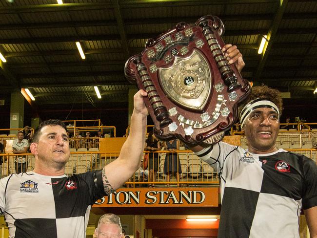 Victory for Uni Pirates over the Casuarina Cougars, Wayne Robinson and Wisa Sekitoga raise the shield . Pic Glenn Campbell