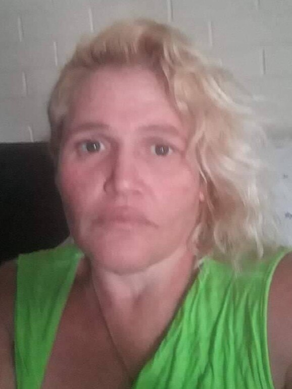 The woman found dead at the Mt Gravatt property on Monday has been identified as Angela Silk.