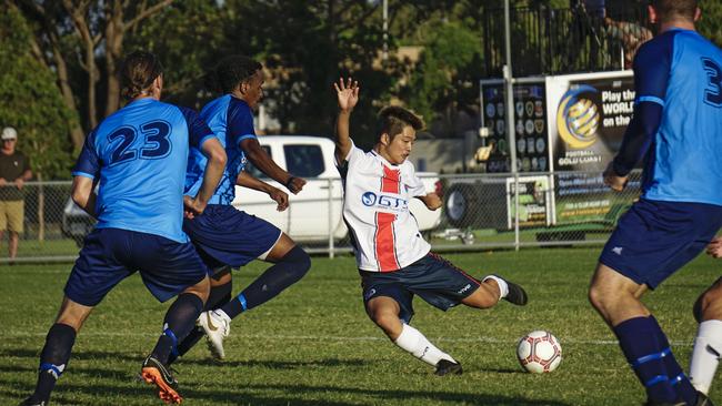 Nerang Soccer Club's Koki Miyasaka negotiates a sea of swirling Tweed Marlins during the two sides' first clash of the year in the 2019 Football Gold Coast Premier League. Picture: Luke Sorensen